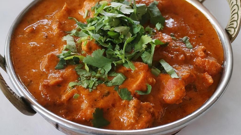 Chicken Tikka Masala · Boneless chicken from oven cooked with onion, green peppers, tomato sauce, and cream. Served with basmati rice.