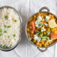 Chana Masala · Vegan. Chickpeas cooked with onions, tomatoes, ginger, garlic, and spices. Served with rice.