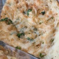 Onion Kulcha · Delicious white flour bread stuffed with onion and cilantro. Indian bread prepared in a clay...