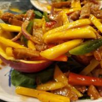 Mango Chicken · Hot. Fresh strips of mango, vegetarian chicken, sautéed onions and red bell peppers sauteed ...