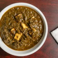 Palak Paneer · Spinach cooked with homemade cottage cheese, herbs and spices.
