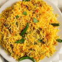 Chicken Biryani · Basmati rice cooked with chicken, spices and special herbs.
