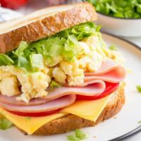The Ham, Egg & Cheese Sandwich · Fresh sizzling scrambled eggs, sizzling ham  and cheese on customer's choice of bread.