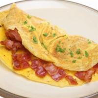 The Classic Omelette · Classic omelette with bacon, ham, sausage and cheddar cheese. Served with Home Fries & Toast.