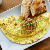 The  Santa Fe Omelette · Sizzling scrambled eggs with onions, jalapeños, cilantro and  cheddar cheese. Served with Ho...