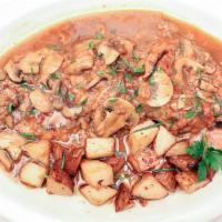 Veal Marsala · Thin Veal sauteed with marsala wine and mushrooms served with potatos