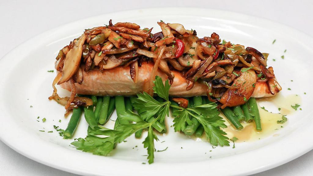 Salmon Al Porcini · Wild salmon grilled, served over string beans, and topped with sauteed onions, mushrooms, and hot cherry peppers