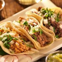 Tacos De Carne Asada (3 Per Order) · Freshly made soft tacos stuffed with juicy steak with chopped fresh cilantro and onions and ...