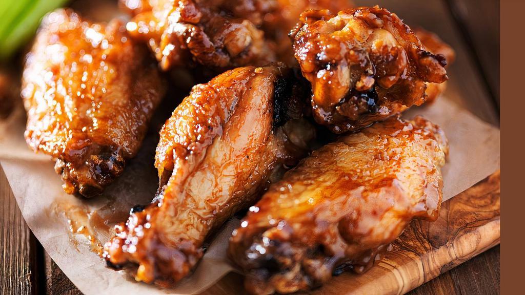 Buffalo Wings · Fried and Tossed in Buffalo or BBQ sauce or served plain