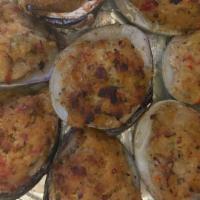 Clams Casino · Claims stuffed with a delicious crabmeat, peppers, onions, and bacon mixture. Topped with se...