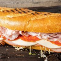 The Italian · Ham, salami, pepperoni, capicola, lettuce, tomato, onions, provolone, oil & vinegar.