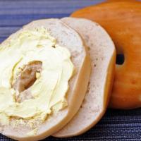 Bagel & Butter · Fresh, daily baked plain bagel with a generous smear of real butter.