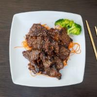 Beef Short Ribs · Grilled beef short ribs with special sauce.