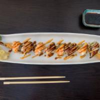 Crazy Dragon Roll · Shrimp tempura, avocado and cucumber inside, topped with eel and shrimp, spicy yaki sauce. C...