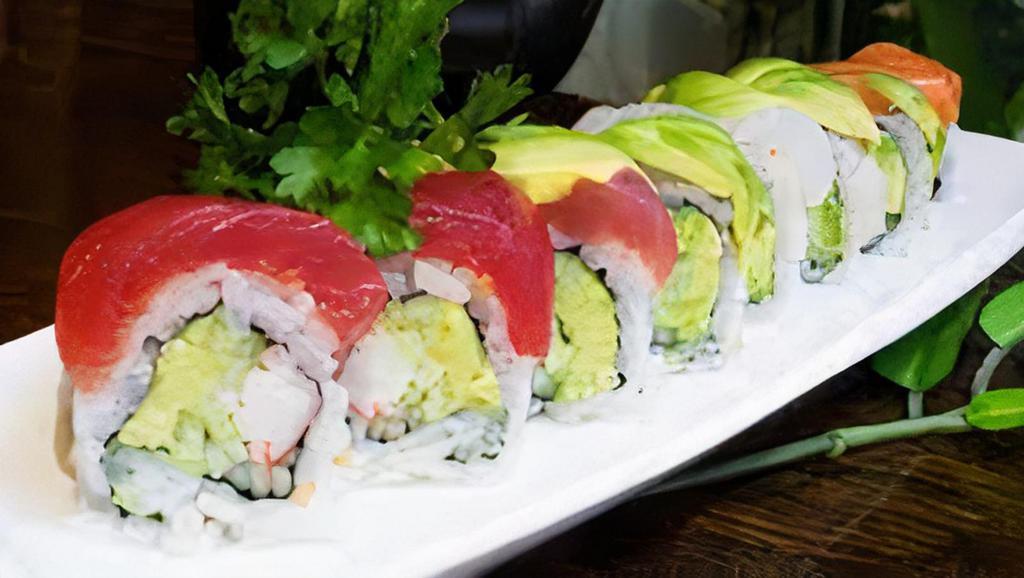 Rainbow Roll (8Pc) · Crabmeat, cucumber, avocado and top with assort fish.
