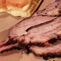 Black Angus Beef Brisket · Sliced beef brisket slow smoked, coated with our hose made dry rub blend. Comes with a half ...
