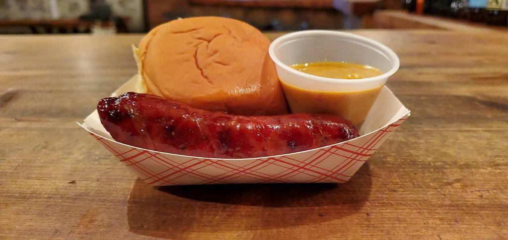 Berkshire Spicy Pork Sausage · Our spicy pork sausage link has a blend of ancho chili, garlic, and other spices. Comes with one Martin's Potato Roll. One link per order. Does not include sauce.