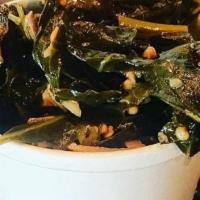 House Made Collard Greens · Our collards are mixed with pork shoulder, vinegar, and crushed red pepper flakes.