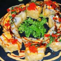 Hado · Salmon, kani, cream cheese inside lightly fried with spicy sauce, eel sauce, caviar, and sca...
