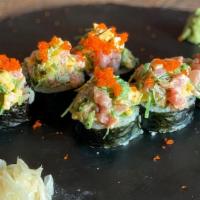 Nyk Roll · Kani, cucumber, avocado inside; topped with chopped tuna, mango and seaweed salad. Chefs spe...