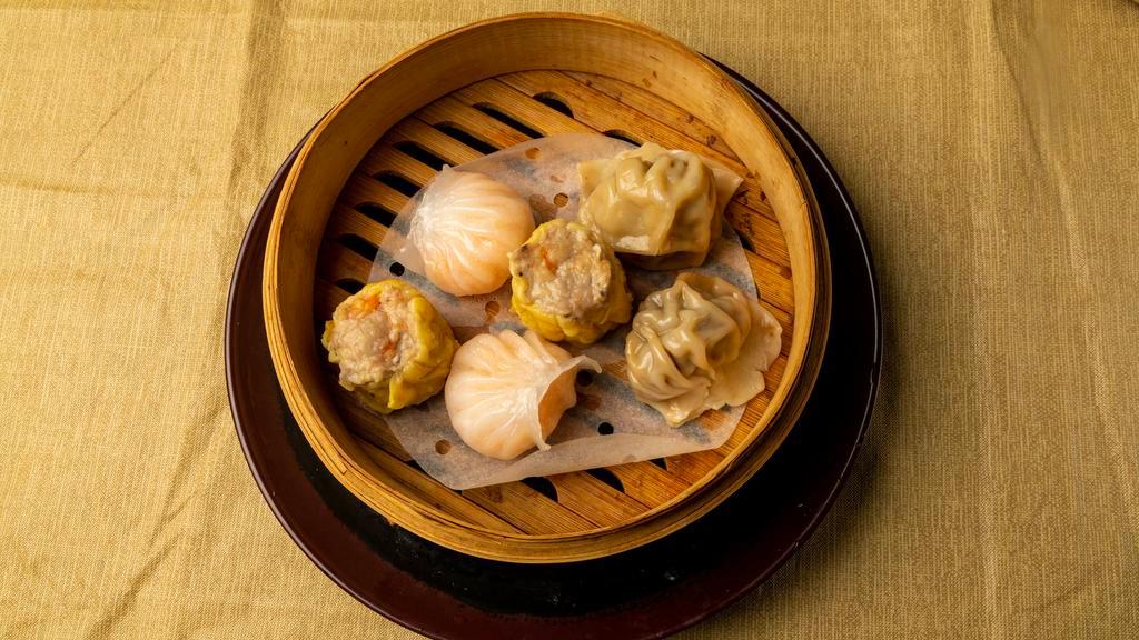 Dim Sum Sampler (2) · Two pieces each. Shumai, crystal shrimp dumpling, and beef dumpling.