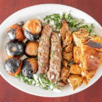 Alkumah Platter · The al kumah platter comes with two skewers of kufta kebab one skewer of chicken kebab one s...