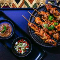 Satay Chicken · Chicken curry kabobs served with satay peanut sauce and cucumber relish