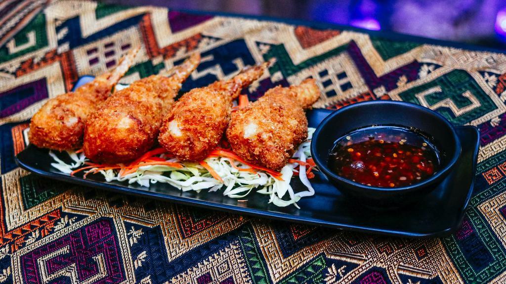 Stuffed Chicken Wings · Deboned chicken wings stuffed with minced chicken, rice noodles, , mushrooms, carrots, onions, bamboo shoots. Deep fried golden crispy. Served with sweet chili sauce.