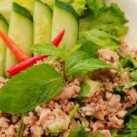 Larb · MINCED MEAT SALAD: Minced meat tossed in fresh lime juice, ground toasted rice, thai herbs a...