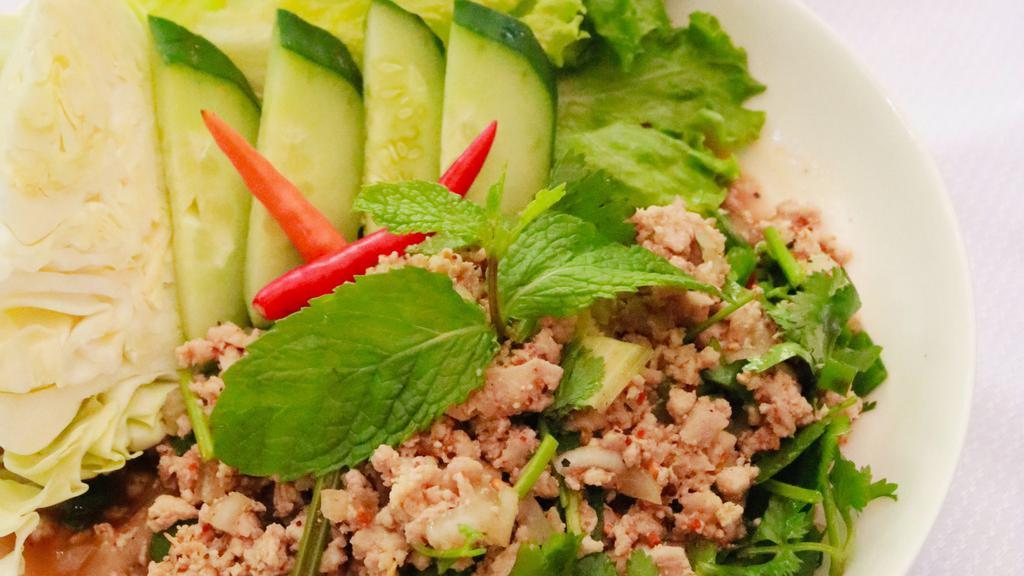 Larb · MINCED MEAT SALAD: Minced meat tossed in fresh lime juice, ground toasted rice, thai herbs and spices, onions, cilantro, and mint.