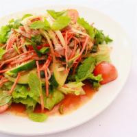 Yum · THAI SALAD: Tomatoes, onions, cucumbers, cilantro, and mint tossed in fresh lime juice, thai...