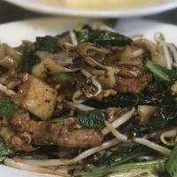 Pad Ki Mao · DRUNKEN NOODLES: Wok fried chow fun noodles in mama olay's spicy sauce, eggs, Chinese brocco...