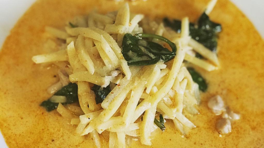 Red Curry · GAENG DAENG: Red curry simmered in coconut milk, bamboo shoots and thai basil.