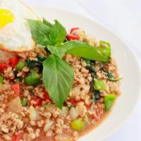 Thai Loco Moco · PAD KRAPOW: Minced meat, bell peppers, onions, and thai holy basil stir fried in mama olay's...
