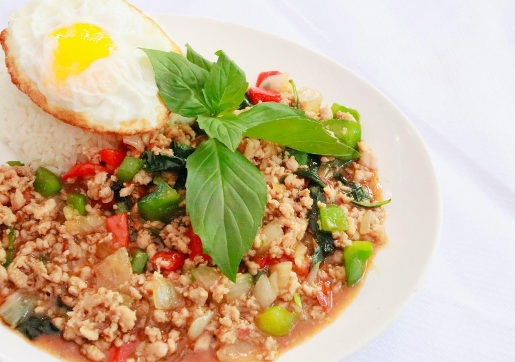 Thai Loco Moco · PAD KRAPOW: Minced meat, bell peppers, onions, and thai holy basil stir fried in mama olay's spicy sauce. Served over rice and topped with sunny egg.