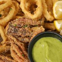 Fried Calamari · Served with salsa verde and spicy ranchera sauce.