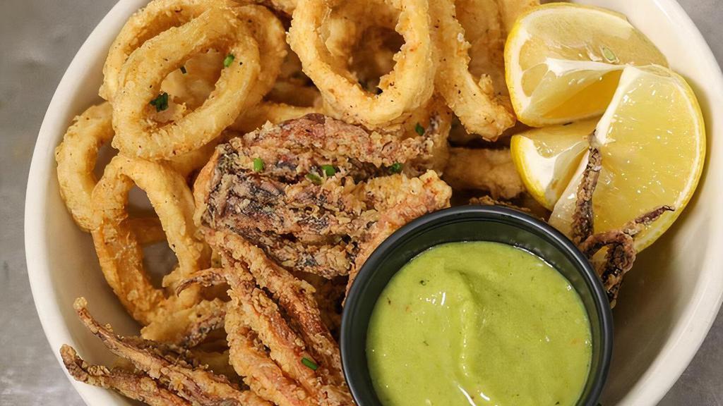 Fried Calamari · Served with salsa verde and spicy ranchera sauce.