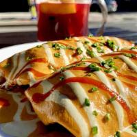 Vegan Enchiladas · sweet potato, kale, black beans, corn tortillas, served with yellow rice, black beans