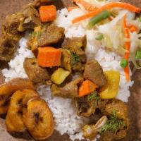 Curry Goat · Tender chunks of curry-clad goat cooked to the bone. Served with Rice & Peas or White Rice w...