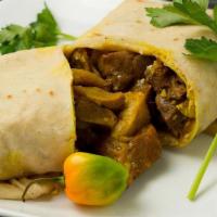 Curry Goat Roti · Tender chunks of curry-clad goat cooked to the bone. Includes potatoes and carrots wrapped i...