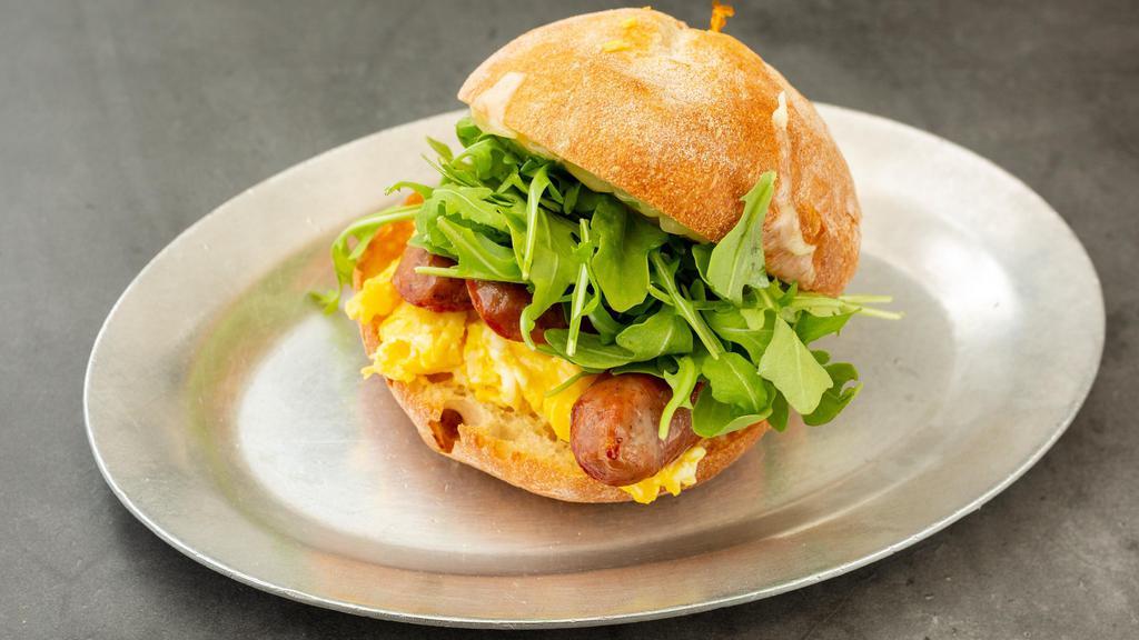 Victor · Soft scrambled eggs, Edward's hickory-smoked sausage, cheddar cheese, and arugula on a Balthazar ciabatta roll. Gluten-free bread currently unavailable.