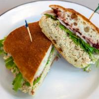 Tuna Berry · House-made tuna salad, romaine, cranberry spread, onion, and horseradish mayo on Caputo's se...