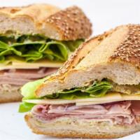 Ham & Cheese · Heritage ham, pickle dijonnaise, Cabot cheddar cheese, and romaine lettuce on sesame seeded ...