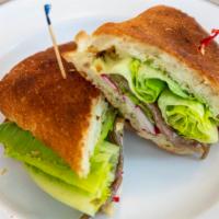 Anchovy Sandwich · Oil-packed anchovy, caper butter, romaine lettuce, herbs, radish, and lemon juice on Sulliva...