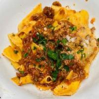 Pappardelle Alla Bolognese · Handmade pasta, veal, beef and pork ragu.