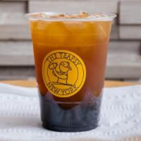 Passion Fruit Green Tea · Passion fruit puree, real cane sugar, and freshly brewed oolong green tea.