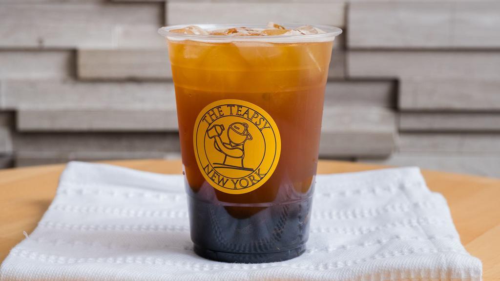 Passion Fruit Green Tea · Passion fruit puree, real cane sugar, and freshly brewed oolong green tea.