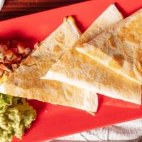 Super Quesadilla
 · A large flour tortilla with your choice of filling served with pico de gallo, guacamole and ...