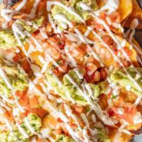 Super Nachos
 · refried beans, pico de gallo, sour cream, guacamole cheese and choice of meat or veggie.