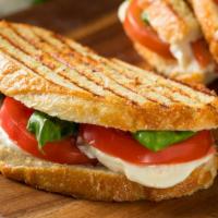 Breakfast Panini · Panini filled with two scrambled eggs, cheddar cheese and roasted red peppers.